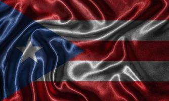 behang met vlag van Puerto Rico en wapperende vlag per stof. foto