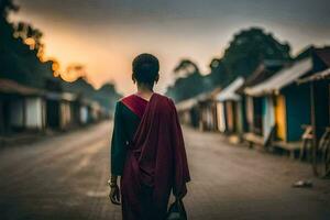 een vrouw in een rood sari wandelingen naar beneden een straat Bij zonsondergang. ai-gegenereerd foto