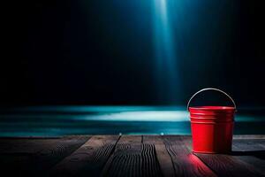 een rood emmer zittend Aan een houten tafel in voorkant van een donker achtergrond. ai-gegenereerd foto