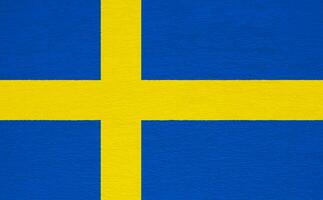vlag van koninkrijk van Zweden Aan een getextureerde achtergrond. concept collage. foto