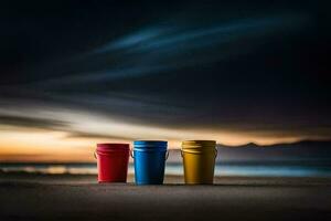 drie kleurrijk emmers zitten Aan de strand Bij zonsondergang. ai-gegenereerd foto