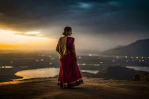 een vrouw in een rood sari staat Aan een heuvel met uitzicht een vallei. ai-gegenereerd foto