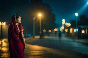 een vrouw in een rood sari staand Aan de straat Bij nacht. ai-gegenereerd foto