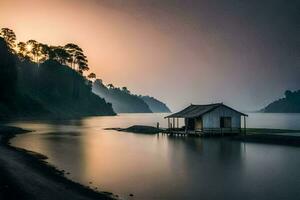 een klein huis zit Aan de kust van een meer Bij zonsondergang. ai-gegenereerd foto