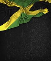 Jamaica vlag vintage op een grunge zwart bord met ruimte voor tekst foto