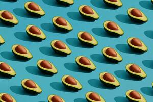 kleurrijk fruit patroon van vers gesneden avocado helften met kuilen Aan blauw pastel achtergrond foto