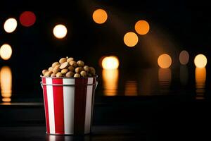 een emmer van popcorn Aan een tafel met lichten in de achtergrond. ai-gegenereerd foto
