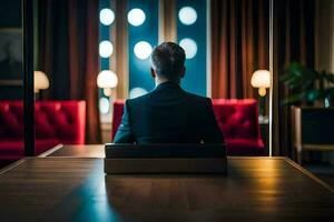 een Mens in een pak zit Bij een tafel in een hotel. ai-gegenereerd foto