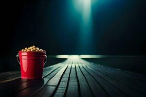 een rood emmer van popcorn zittend Aan een houten tafel. ai-gegenereerd foto