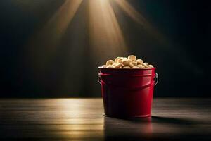 een rood emmer gevulde met popcorn Aan een tafel. ai-gegenereerd foto