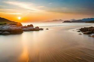 de zon sets over- een strand met rotsen en water. ai-gegenereerd foto