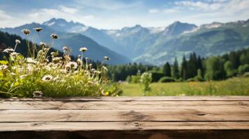 houten tafel met een achtergrond van een wilde bloemen weide met een berg reeks foto