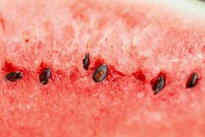 heerlijk watermeloen met zaden, detailopname. zomer tijd, rood structuur foto