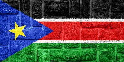 vlag van republiek van zuiden Soedan Aan een getextureerde achtergrond. concept collage. foto