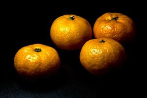 glanzende oppervlaktetextuur van versheid oranje fruit foto