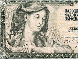 vrouw met sikkel van Joegoslavië geld foto