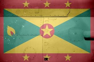 Grenada vlag afgebeeld Aan kant een deel van leger gepantserd helikopter detailopname. leger krachten vliegtuig conceptuele achtergrond foto