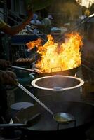 brand brandend over- straat voedsel Koken fornuis in Bangkok Thailand foto