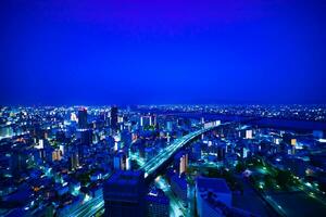 een dageraad panoramisch stadsgezicht in de buurt jodo rivier- in Osaka breed schot foto