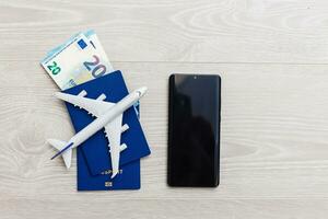 mockup beeld van mobiel smartphone , vliegtuig en controleren boek geïsoleerd Aan wit achtergrond. bedrijf technologie reis en reizen, salaris concept. foto