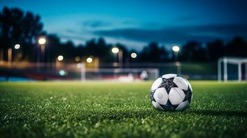 voetbal bal Aan groen gras van Amerikaans voetbal stadion Bij nacht met lichten foto