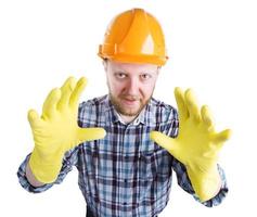 man in een helm en gele handschoenen foto