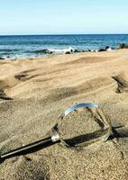 vergroten glas Aan de strand foto