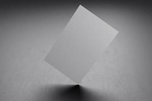witte verticale sjabloon voor visitekaartjespapier met lege ruimtedekking voor het invoegen van bedrijfslogo of persoonlijke identiteit op zwarte kartonnen achtergrond. modern begrip. 3d illustratie render foto