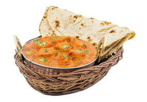 Indisch heerlijk keuken paneer tikka masala met tandoori chapati Aan wit achtergrond foto