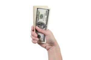 stack van geld in een hand- geïsoleerd Aan wit achtergrond foto