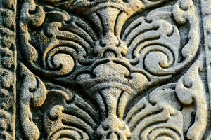 detail van gesneden steen Bij Angkor wat, Cambodja foto
