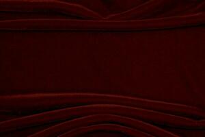rood fluweel kleding stof structuur gebruikt net zo achtergrond. leeg rood kleding stof achtergrond van zacht en glad textiel materiaal. Daar is ruimte voor tekst... foto