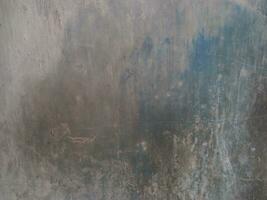 verweerd beton muur. grunge blauw en grijs muur achtergrond. beschadigd cement oppervlak. oud muur gebouw. foto