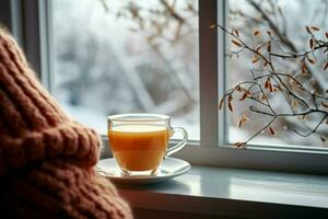 ai gegenereerd kop van thee of koffie mok Aan tafel in de buurt venster winter vakantie ai gegenereerd foto
