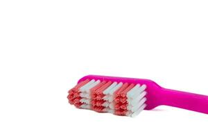 roze tandenborstel Aan wit achtergrond foto
