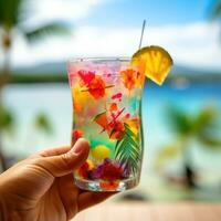 ai gegenereerd hand- Holding een kleurrijk cocktail glas met een tropisch strand achtergrond foto