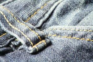 detailopname van blauw jeans en denim details. foto