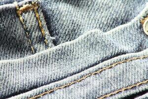 detailopname van blauw jeans en denim details. foto