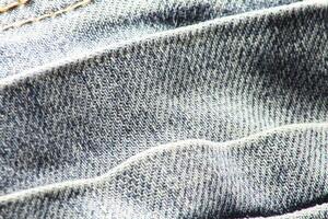 detailopname van blauw jeans en denim details. foto