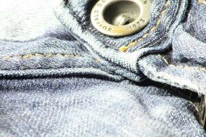 detailopname van blauw jeans en denim details. foto