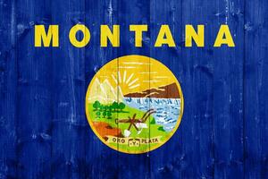 vlag van Montana Verenigde Staten van Amerika staat Aan een getextureerde achtergrond. concept collage. foto