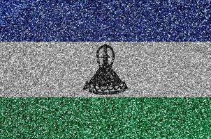 Lesotho vlag afgebeeld Aan veel klein glimmend pailletten. kleurrijk festival achtergrond voor partij foto
