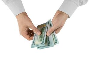 Mens handen met dollar contant geld geïsoleerd Aan wit achtergrond foto
