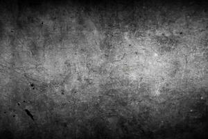 donker grijs of zwart beton muur getextureerde achtergrond foto