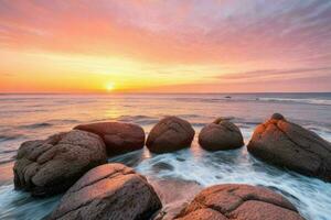 ai gegenereerd mooi rotsen Aan de strand Bij zonsondergang. pro foto