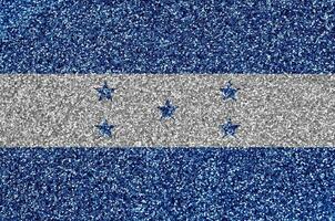 Honduras vlag afgebeeld Aan veel klein glimmend pailletten. kleurrijk festival achtergrond voor partij foto