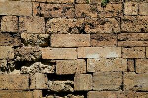 achtergrond structuur van kalksteen blokken muur foto