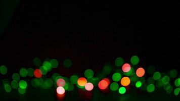 veelkleurig lichten Aan een donker achtergrond. kerstmis, nieuw jaar achtergrond foto