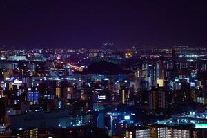 een nacht stadsgezicht door hoog hoek visie in de buurt kyocera koepel in Osaka telefoto schot foto