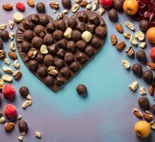 ai gegenereerd chocola snoepjes met noten en fruit in hart vorm Aan een blauw achtergrond foto